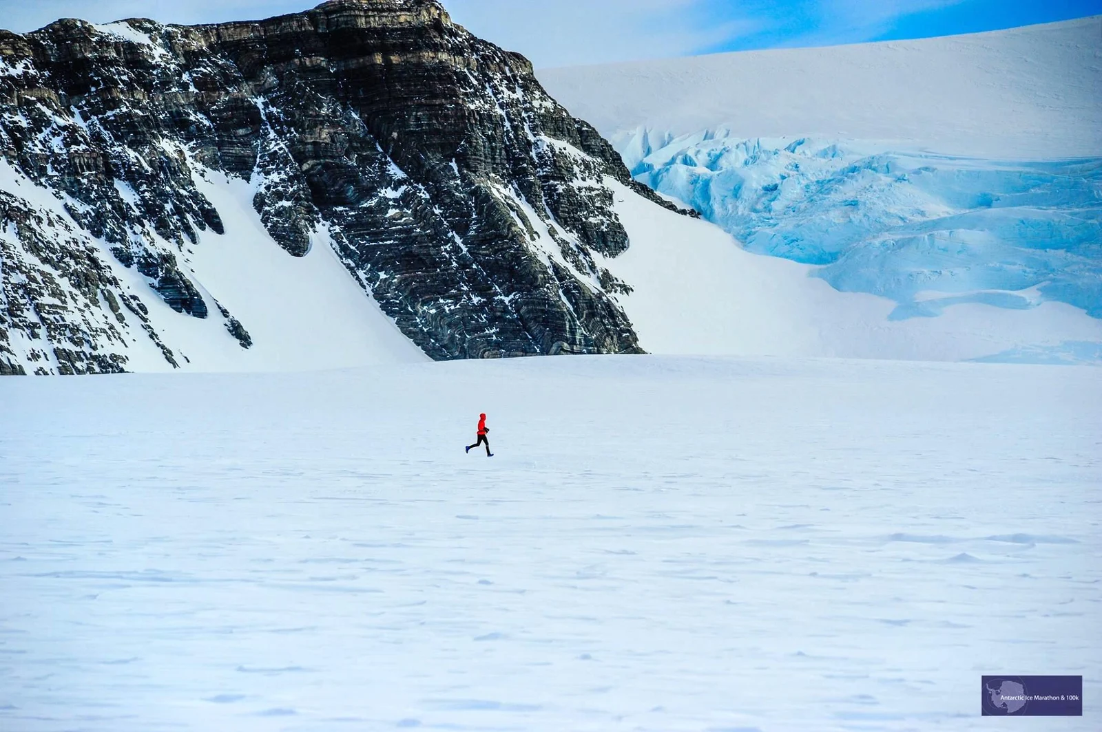 Antarctic Ice Marathon runner beneath the glacier