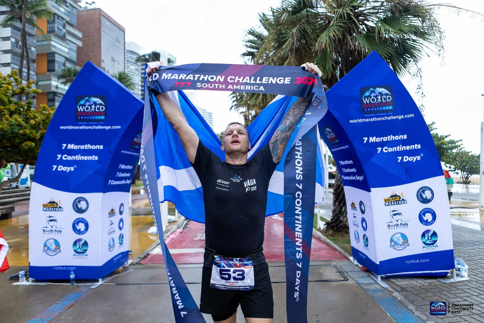 World Marathon Challenge finisher at the race arch
